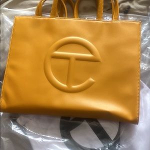 medium Mustard Yellow Telfar Bag, never worn selling for colllege books